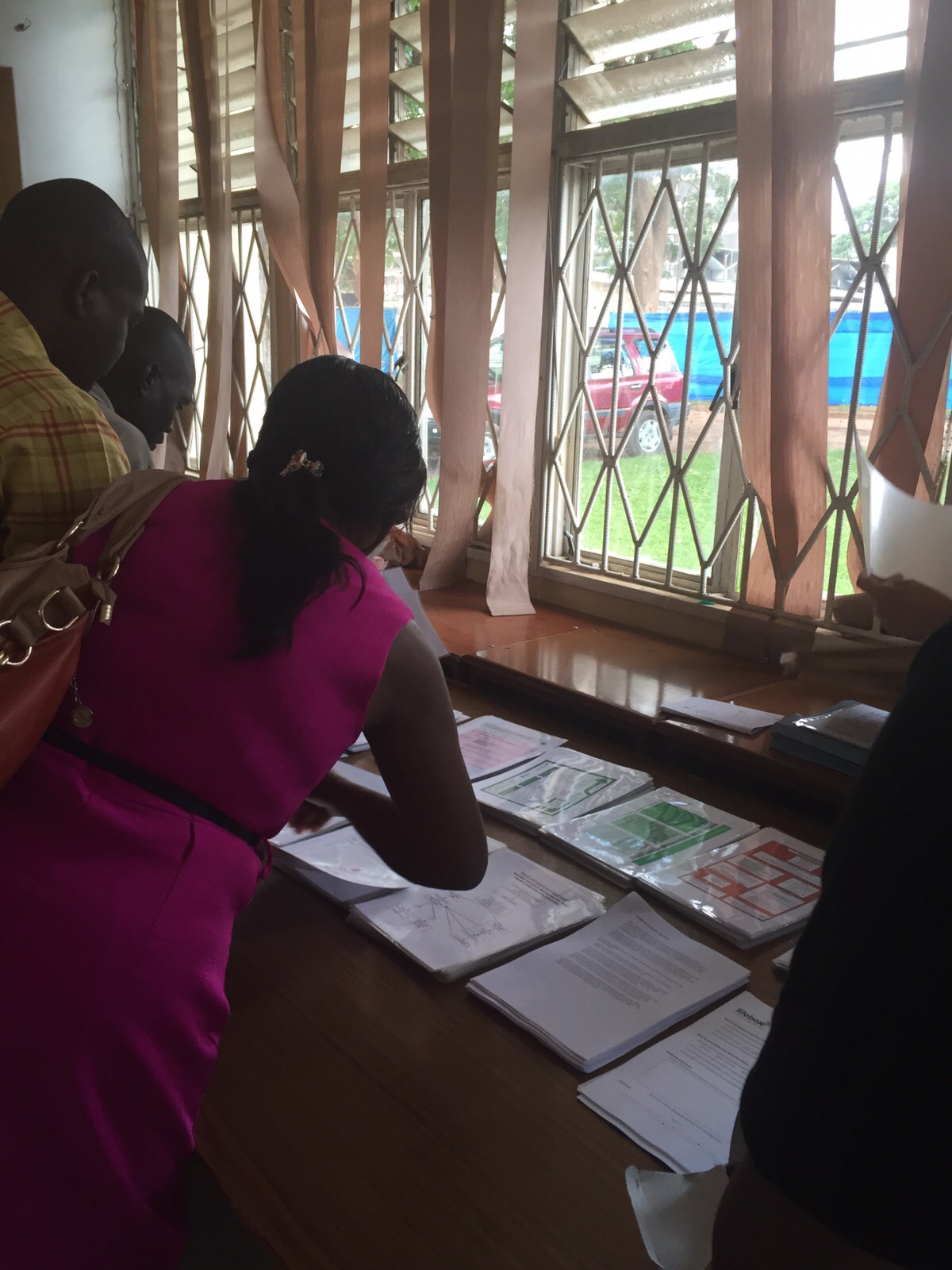 151123_Zambia_Ndola workshop_Boe Mathe_reviewing Lifebox education materials